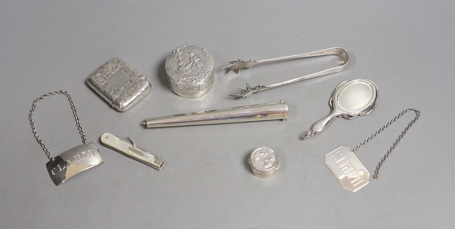 A 9ct gold cased propelling toothpick and nine other small silver or white metal items including pill box, handbag mirror, tongs, fruit knife etc.
